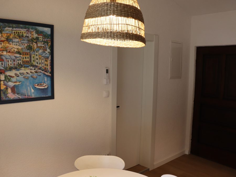Hallway with local artwork and warm lighting